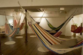 Illustration for article titled Japan's Hammock Cafes Are Perfect for Lazy People